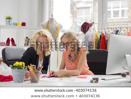 Stock photo: Two Young Professional Fashion Designer Colleagues Working And P