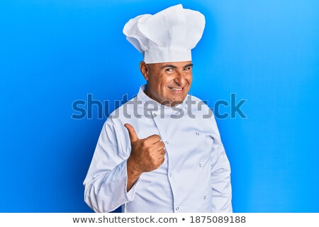 Stockfoto: Portrait Of Mature Male Chef Gesturing Thumbs