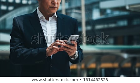 Сток-фото: Anonymous Man Using Smartphone