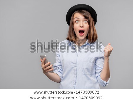 Pretty Surprised Girl In Hat And Shirt Looking At You Stockfoto © Pressmaster