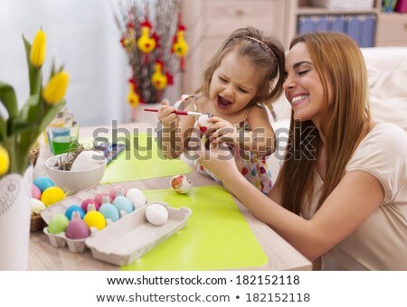 Stockfoto: Girl Decorating Willow By Easter Eggs At Home