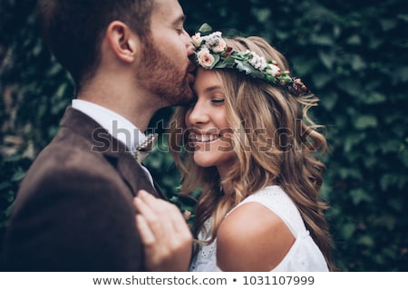 Foto stock: Beautiful Young Wedding Couple Kissing
