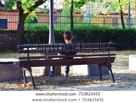 Stockfoto: Boy On A Bench