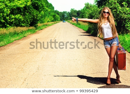 Stock photo: Young Woman Hitchhiking