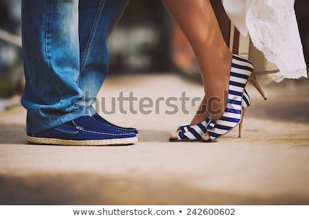 Stockfoto: Blue Flowers And Black Female Shoes