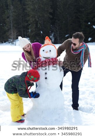 Father And Daughter Making A Snowman Foto stock © dotshock