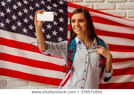 Stock foto: Portrait Of Happy Teenagers Standing Against American Flag