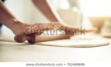 Сток-фото: Baker Hands Preparing Fresh Dough With Rolling Pin On Kitchen Table