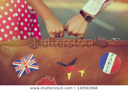 Stok fotoğraf: Young Woman With Suitcase In Paris