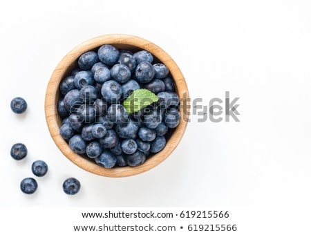 Stok fotoğraf: Blueberry In Bowl On Blue Background