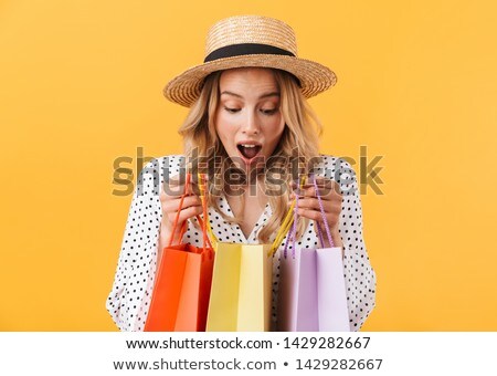 Stockfoto: Portrait Of Young Excited Pretty Woman Standing Inside Shopping