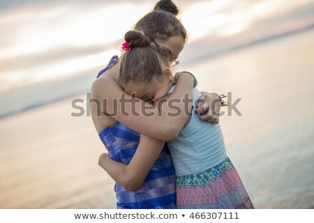 Tchildren Sister Hugging At The Sunset Beach Foto d'archivio © Lopolo