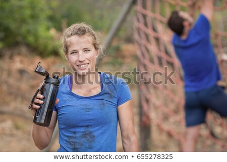 Foto d'archivio: Portrait Of Tired Woman During Obstacle Course