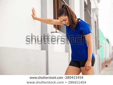 Foto stock: Female Urban Athlete Leaning On A Wall