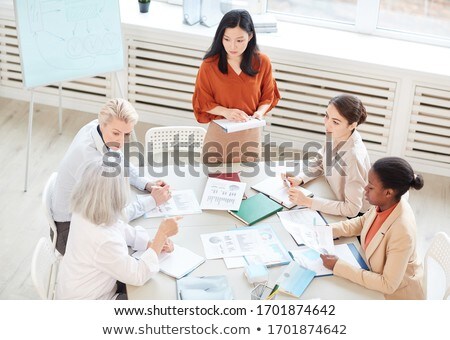 Сток-фото: High Angle View Of Young Multi Ethnic Businesswomen Discussing Over Digital Tablet On Escalator In M