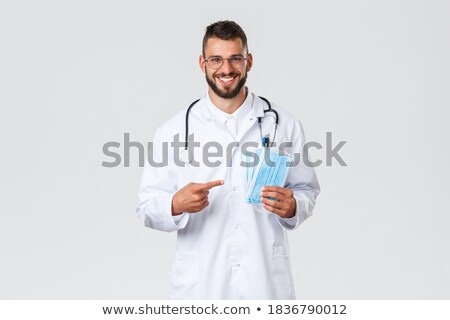 Foto stock: Doctor With Face Mask Asking For Safe Distance