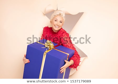 Woman Holding A Present Zdjęcia stock © NeonShot