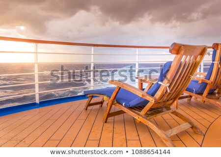 Сток-фото: Blue Deck Chair On A Wooden Pier