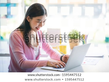 Zdjęcia stock: Attractive Young Beautiful Asian Woman Working With Laptop And D