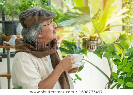 Stock fotó: Senior Citizen Relaxing In His Garden