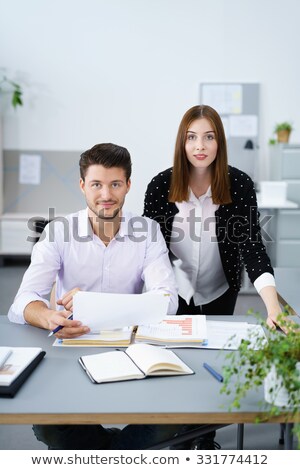 [[stock_photo]]: Man Stood Holding Official Document