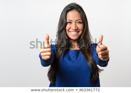 Foto stock: Brunette Giving Thumbs Up Gesture