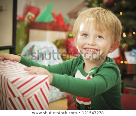 ストックフォト: Young Boy Enjoying Christmas Morning Near The Tree