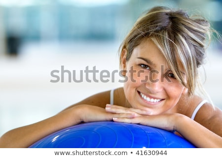 Foto stock: Portrait Of Fit And Healthy Gym Woman With Ball At Fitness Club