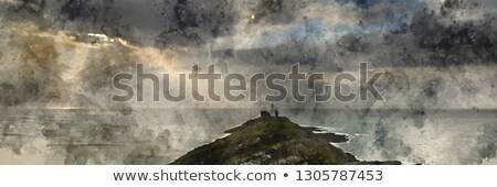 Stock photo: Landscape Panorama Of Mumbles Lighthouse In Wales With Sunbeams