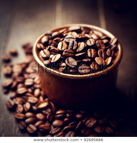 Foto stock: Coffee Beans In A Ceramic Bowl Wooden Background