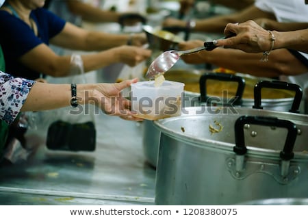 Foto stock: Warm Food For The Poor And Homeless