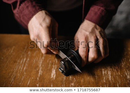 [[stock_photo]]: A Butcher Sharpening His Knife