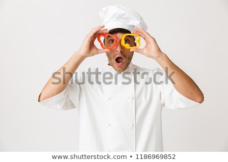 ストックフォト: Chef Man Isolated Over White Wall Background Covering Eyes With Paprika