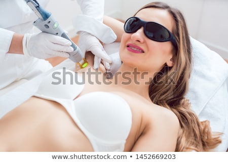 Foto stock: Woman During Hair Removal Using Modern Laser Technology