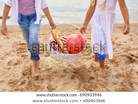 Little Girl Carrying Basket Of Baguettes Stock photo © Pressmaster