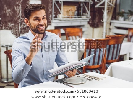 Foto stock: Businessman Holding The Menu In A Restaurant