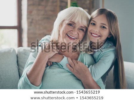 Stock photo: Cute Blonde Woman Cuddling With A Piggybank