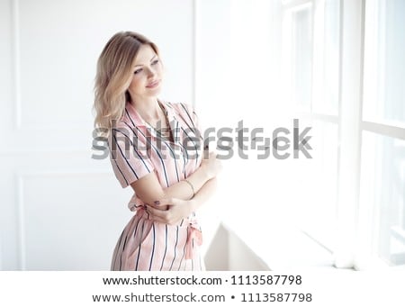Stok fotoğraf: Happy Beautiful Woman Staring Out The Window