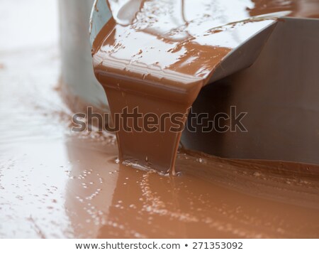 Сток-фото: Hot Milk Chocolate Flow Or Stream On Factory