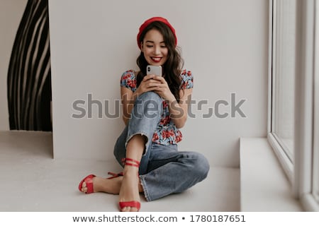 Foto stock: Lovely Woman In Red Blouse And Jeans