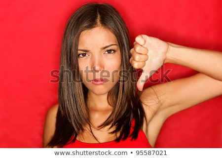 Unhappy Asian Young Woman Giving Thumbs Down Gesture Stockfoto © Ariwasabi