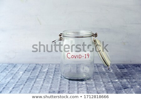 Stockfoto: Money Jar With Lockdown Fundraising Label