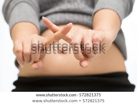 Stock fotó: Pregnant Woman Breaking A Cigarette In Two