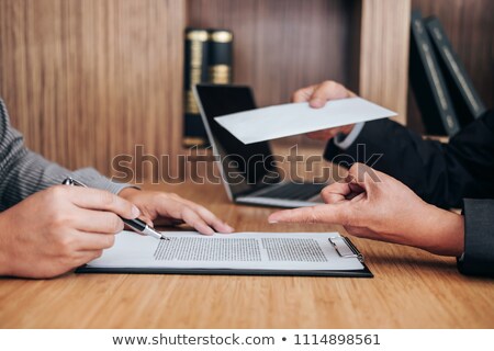 Hand Of Employer Filing Final Remuneration To Employee Letter O Stock foto © Freedomz