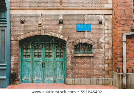 Stock photo: Lamp Front Of A Brick Wall