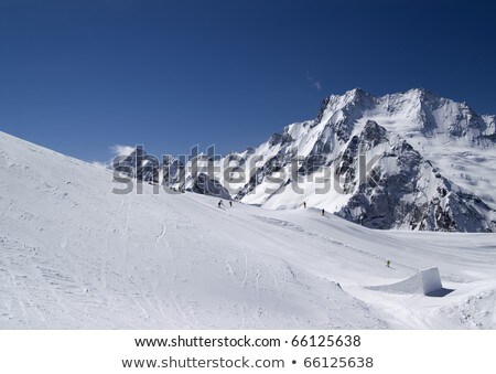 Mountain Landscape With Snow And Man Flying In The Sky Сток-фото © Lizard