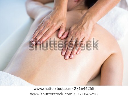 Stock fotó: Content Brunette Getting A Back Massage