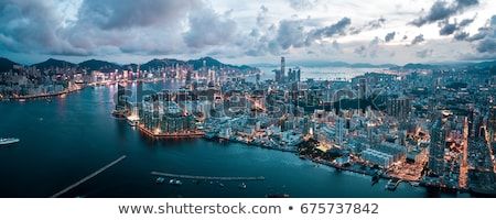 ストックフォト: Hong Kong Skyline And Victoria Harbor Evening Aerial View