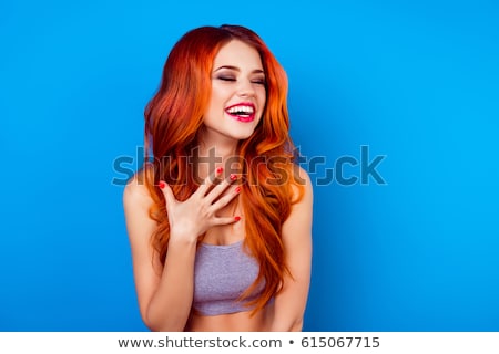 Foto d'archivio: Happy Lovely Young Woman With Long Hair Standing And Smiling