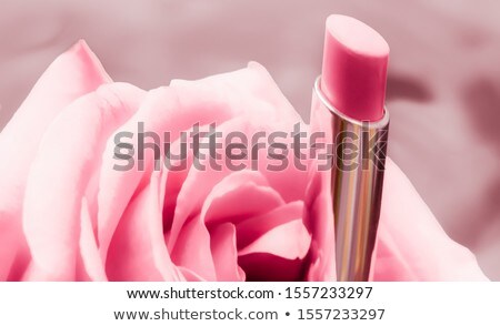 Stock photo: Pink Lipstick And Rose Flower On Liquid Background Waterproof G